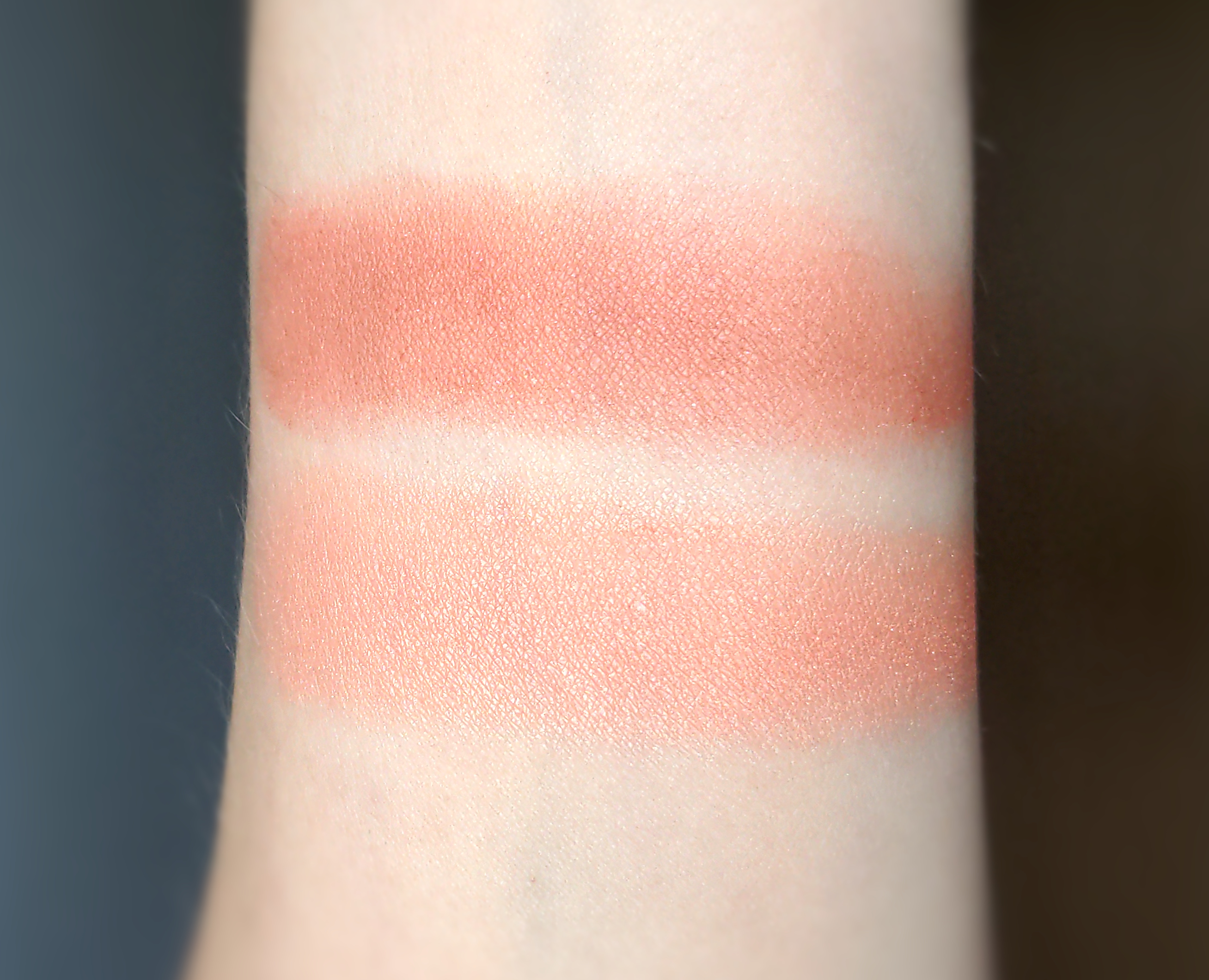 Swatches of Milani Baked Powder Blush in 15 Sunset Passione and 05 Luminoso.